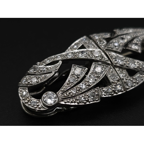 267 - A 1920s Art Deco Platinum and Diamond Duette Brooch. 3.5ctw of bright round cut diamonds. Can be wor... 