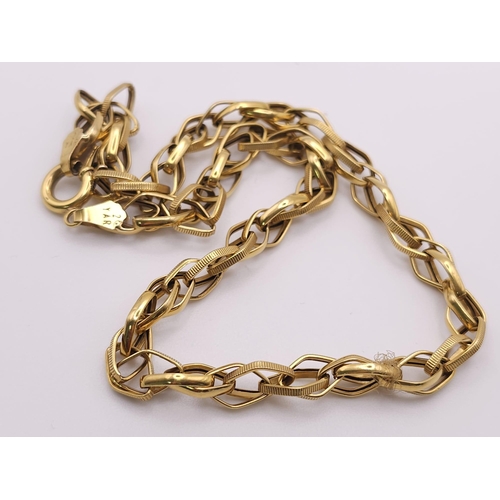 275 - An 18K Yellow Gold Intricate Link Chain/Necklace. 40cm length. 9.9g weight.