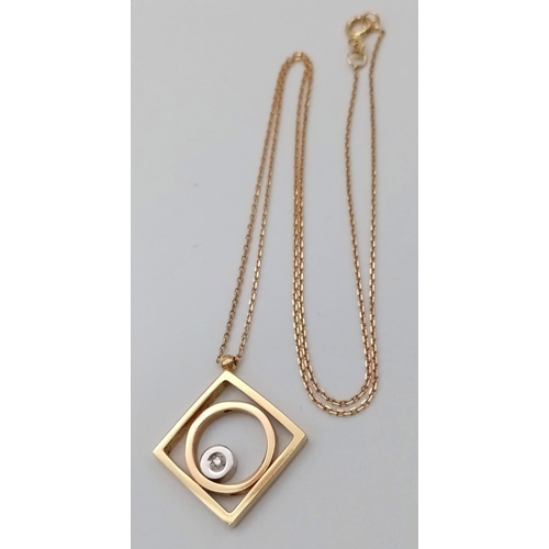 310 - An 18K Yellow Gold and Diamond Abstract Pendant on an 18K Gold Disappearing Necklace. 16 x 16mm pend... 