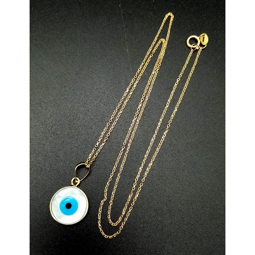 317 - An 18K Gold and Enamel Evil Eye Pendant on an 18K Yellow Gold Disappearing Necklace. 12mm diameter p... 