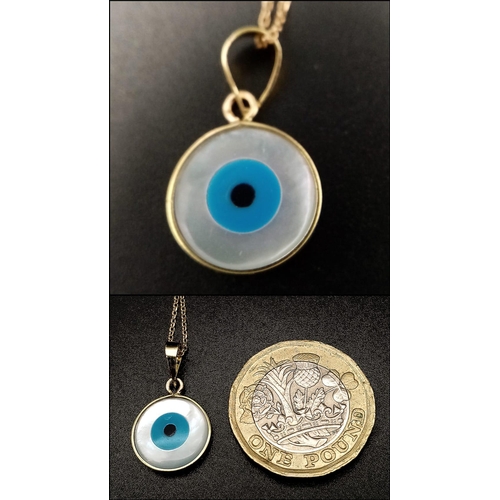 317 - An 18K Gold and Enamel Evil Eye Pendant on an 18K Yellow Gold Disappearing Necklace. 12mm diameter p... 