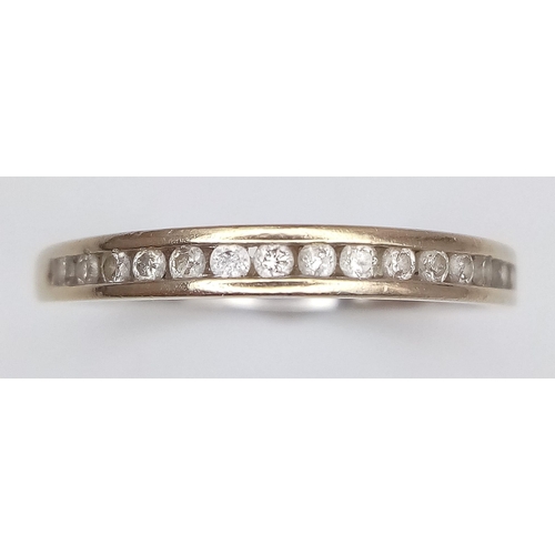 509 - AN 18K YELLOW GOLD DIAMOND BAND RING. Size N/O, 0.18ctw, 1.9g total weight.