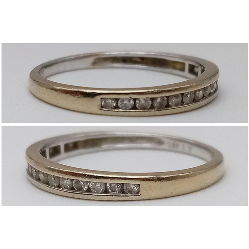 509 - AN 18K YELLOW GOLD DIAMOND BAND RING. Size N/O, 0.18ctw, 1.9g total weight.