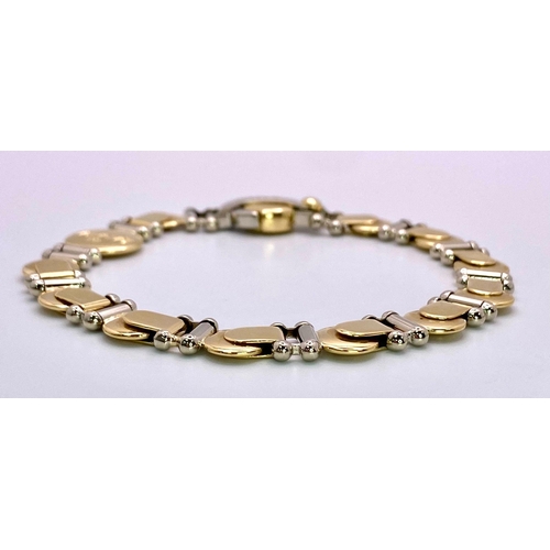 555 - A Designer Baraka 18K Yellow and White Gold Fancy Link Bracelet. 20cm. 29.35g weight.