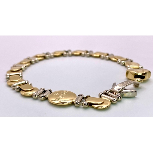 555 - A Designer Baraka 18K Yellow and White Gold Fancy Link Bracelet. 20cm. 29.35g weight.