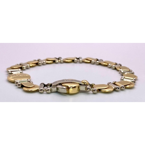 555 - A Designer Baraka 18K Yellow and White Gold Fancy Link Bracelet. 20cm. 29.35g weight.