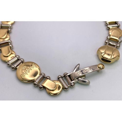 555 - A Designer Baraka 18K Yellow and White Gold Fancy Link Bracelet. 20cm. 29.35g weight.