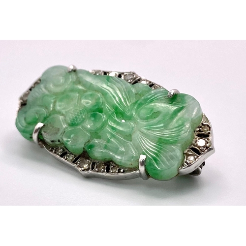 60 - A Wonderful Art Deco Platinum, Diamond and Jade Brooch. A
Chinese green and white pierced decorative... 