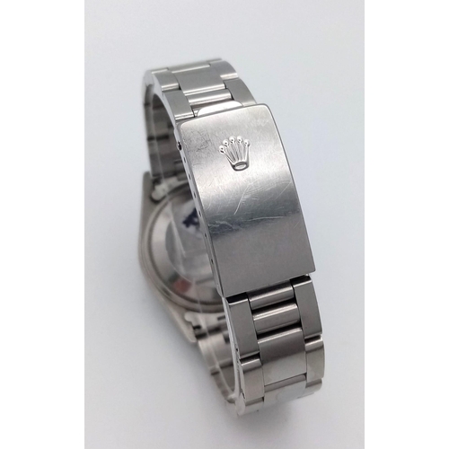 61 - A Rolex Oyster Perpetual Datejust Gents Watch. Stainless steel bracelet and case - 35mm. Silver tone... 