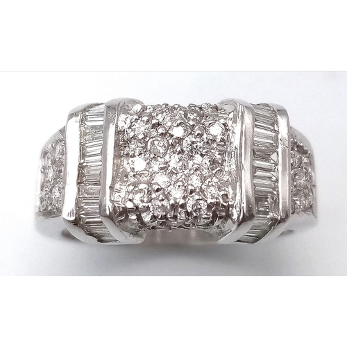 66 - A Sophisticated 18K White Gold Mixed Diamond Ring. Pave set diamonds in-between two bars filled with... 