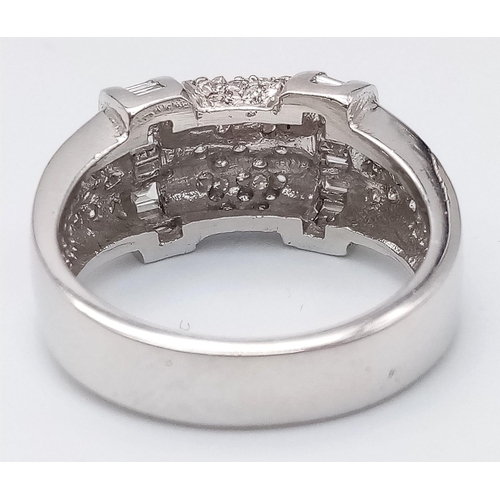 66 - A Sophisticated 18K White Gold Mixed Diamond Ring. Pave set diamonds in-between two bars filled with... 