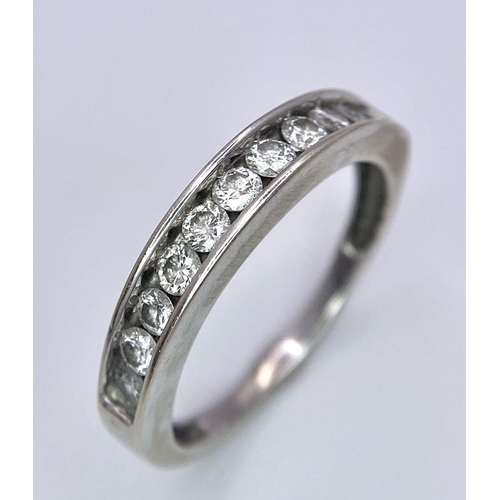 88 - A 14K White Gold, Diamond Half-Eternity Ring. Size N. 2.55g total weight. Ref: 10437