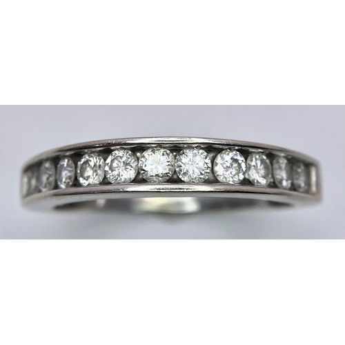 88 - A 14K White Gold, Diamond Half-Eternity Ring. Size N. 2.55g total weight. Ref: 10437