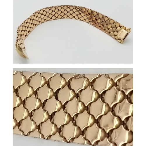 92 - An Italian 18K Gold Tri-Colour Bracelet. An incredible piece of craftmanship with diamond mesh patte... 