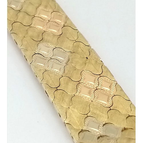 92 - An Italian 18K Gold Tri-Colour Bracelet. An incredible piece of craftmanship with diamond mesh patte... 