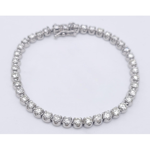 324 - A 5ct Diamond 900 Platinum Tennis Bracelet. 38 brilliant round cut diamonds of a high grade create a... 