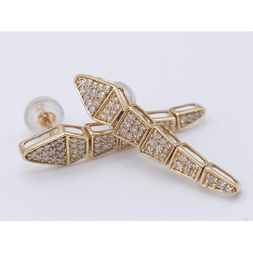 367 - A Serpentine 18K Yellow Gold and Diamond Ring with a Pair of 18K Yellow Gold and Diamond Drop Earrin... 