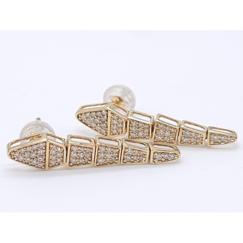 367 - A Serpentine 18K Yellow Gold and Diamond Ring with a Pair of 18K Yellow Gold and Diamond Drop Earrin... 