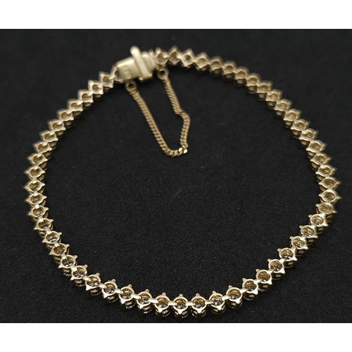 673 - An 18K Yellow Gold and 5ct Diamond Tennis Bracelet. 56 high-grade brilliant round cut diamonds give ... 