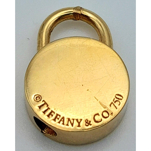 82 - 18K YELLOW GOLD GENUINE TIFFANY & CO ROUND LOCKET.
WEIGHS 13.5G AND MEASURES 2CM.

REF: SC 7088