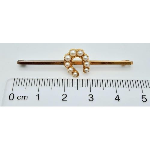 218 - AN ANTIQUE 9K GOLD BAR BROOCH WITH LUCKY HORSESHOE DECORATED WITH SEED PEARLS, IN ORIGINAL BOX .    ... 