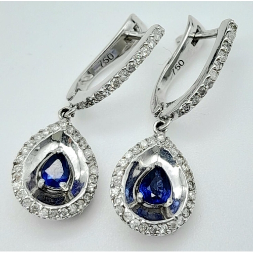 303 - A Pair of 18K White Gold Diamond and Sapphire Teardrop Earrings. Teardrop sapphires with teardrop di... 