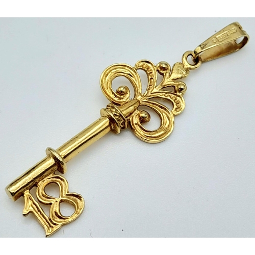 754 - A 9K GOLD 18 KEY PENDANT .   2.1gms