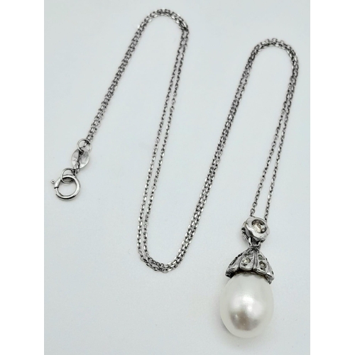 85 - An 18K White Gold, South Sea Pearl and Diamond Pendant on an 18k White Gold Disappearing Necklace. 2... 