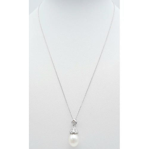 85 - An 18K White Gold, South Sea Pearl and Diamond Pendant on an 18k White Gold Disappearing Necklace. 2... 