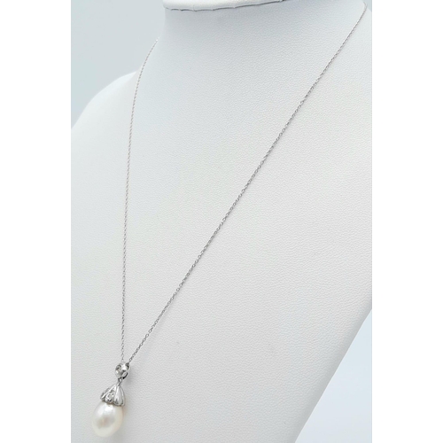 85 - An 18K White Gold, South Sea Pearl and Diamond Pendant on an 18k White Gold Disappearing Necklace. 2... 