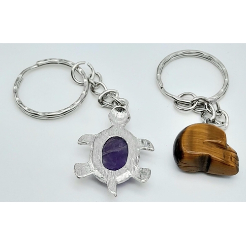 904 - Two Gemstone Keyrings - A Tigers Eye Skull - 7cm and an Amethyst Turtle - 9cm.