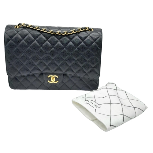 598 - Black Chanel Maxi Bag.
Quilted leather stitched in diamond pattern. Gold toned hardware and typical ... 