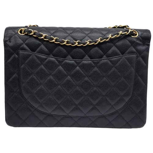 598 - Black Chanel Maxi Bag.
Quilted leather stitched in diamond pattern. Gold toned hardware and typical ... 