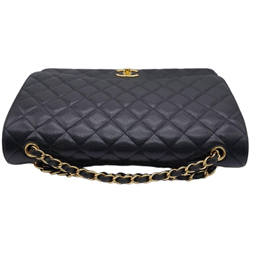 598 - Black Chanel Maxi Bag.
Quilted leather stitched in diamond pattern. Gold toned hardware and typical ... 