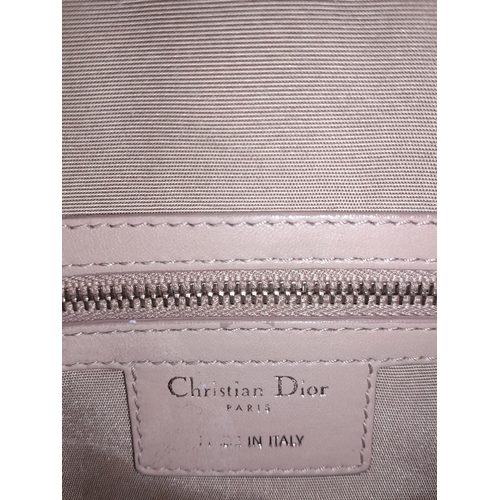 108 - Christian Dior Cannage, Quilted Side Pocket Satchel.
Extremely soft and luscious to the touch, this ... 