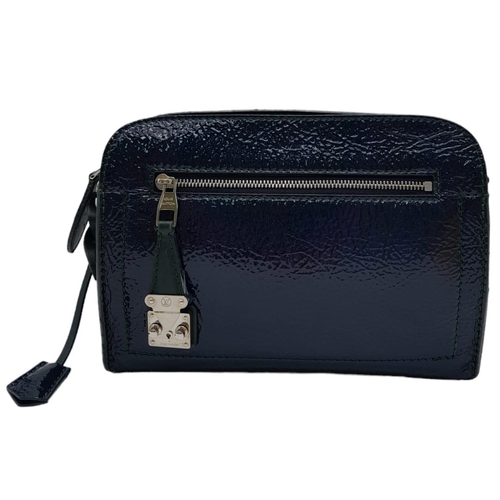 11 - A Louis Vuitton Dark Navy Blue Vernis Pochette Bag. Patent leather exterior with silver toned hardwa... 