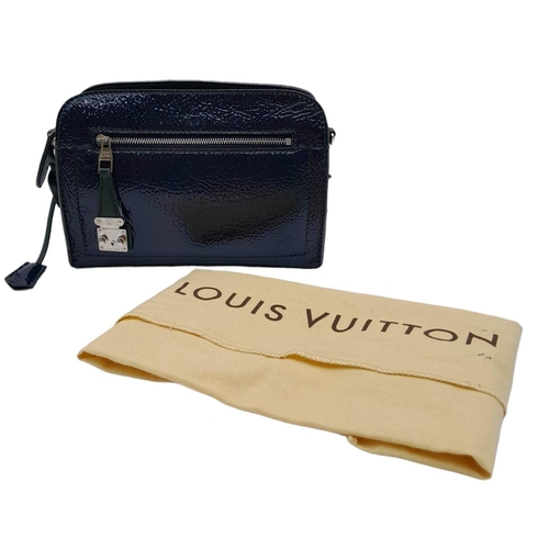 11 - A Louis Vuitton Dark Navy Blue Vernis Pochette Bag. Patent leather exterior with silver toned hardwa... 