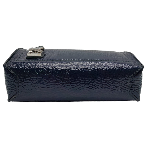 11 - A Louis Vuitton Dark Navy Blue Vernis Pochette Bag. Patent leather exterior with silver toned hardwa... 