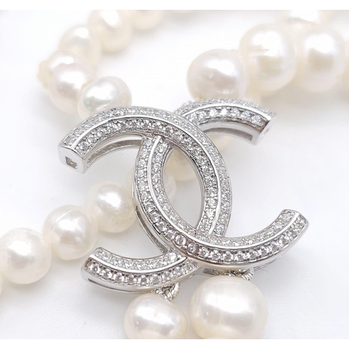 1177 - A Two-Strand Cultured Pearl Necklace with a CC Clasp. 84cm length.