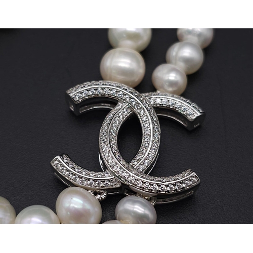 1177 - A Two-Strand Cultured Pearl Necklace with a CC Clasp. 84cm length.