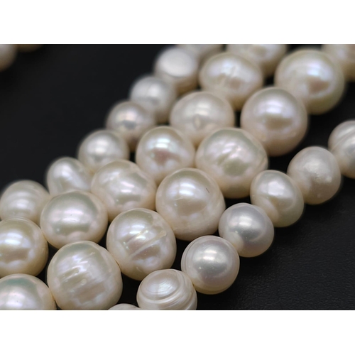 1177 - A Two-Strand Cultured Pearl Necklace with a CC Clasp. 84cm length.