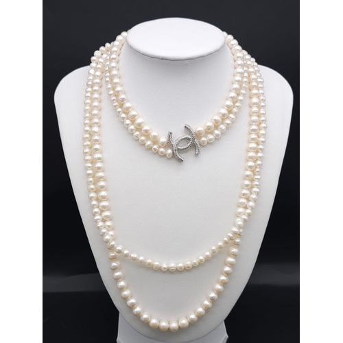 1177 - A Two-Strand Cultured Pearl Necklace with a CC Clasp. 84cm length.