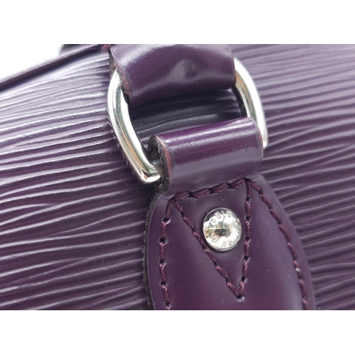 129 - A Louis Vuitton Burgundy Jasmin Cassis Handbag. Epi leather exterior with two rolled leather handles... 