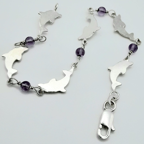 1412 - A fancy 925 silver Dolphin & Lilac stone link bracelet. Total weight 4.3G. Total length 17cm.