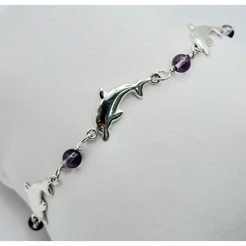 1412 - A fancy 925 silver Dolphin & Lilac stone link bracelet. Total weight 4.3G. Total length 17cm.