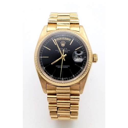 22 - A Solid 18K Gold Rolex Oyster Perpetual Day-Date Gents Watch. 18k gold bracelet and case - 36mm. Bla... 