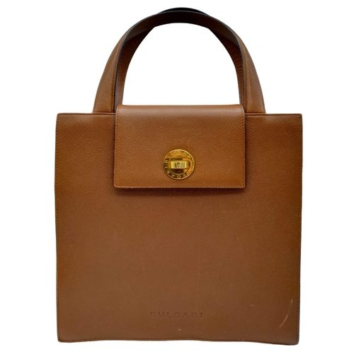 249 - Bvlgari Tan Leather Handbag.
This bag is like the Dr Who, Tardis, when opened it's 'filling style' i... 