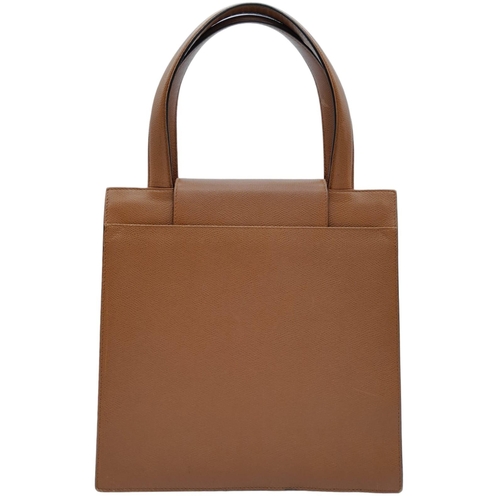 249 - Bvlgari Tan Leather Handbag.
This bag is like the Dr Who, Tardis, when opened it's 'filling style' i... 