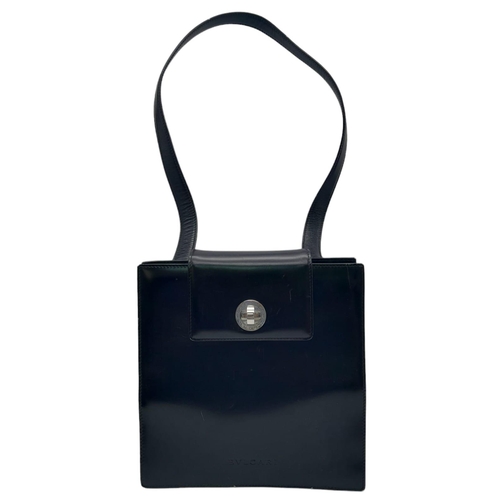 291 - A Bvlgari Black Bag. Leather exterior with silver toned hardware, leather strap, flap and twist-clas... 