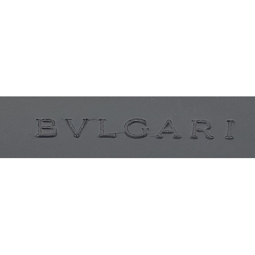 291 - A Bvlgari Black Bag. Leather exterior with silver toned hardware, leather strap, flap and twist-clas... 